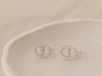 Full pavé stud earrings with a chic, luxe look